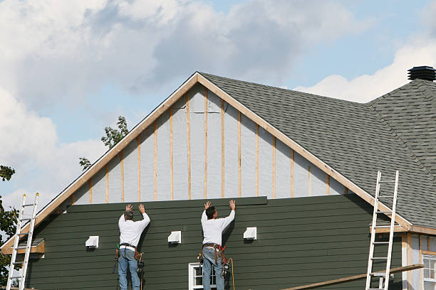 Professional Siding Contractor technician working in East Boston, MA